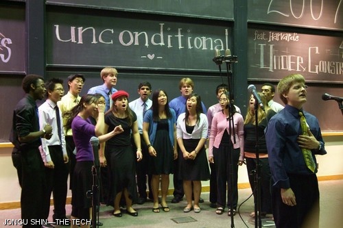Daniel Wandel ’04 (right) sings a solo as members of the Cross Products croon along during their Saturday, May 12 spring concert.
