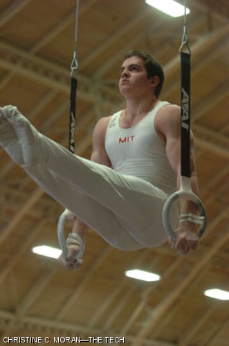 Boris Rasin '09 performs an L-seat on the still rings during Saturday's gymnastics meet against Temple University.