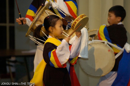 Hyuna Do (left) and Hyunwoo Do (right) play Korean drums at the Korean Student Association’s Culture Show held last Sunday in Walker Memorial.