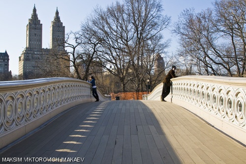 Two individuals are seen on a footbridge in Central Park in New York, NY on Wednesday, March 26.