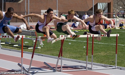 Anthony D. Teixeira ’08 (second from left) and David P. Fernholz ’10 (right) compete in the men’s 110 meter hurdles. Teixeira won the event in 15.21 seconds.