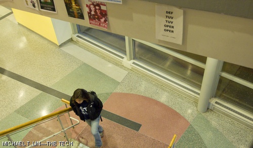 Jessica Sunmee Kim ’10 is seen walking past a Nightline poster in Building 16 on Monday.