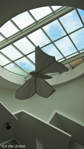 An origami butterfly, designed and built by Michael G. LaFosse and Richard L. Alexander, is seen hanging on display August 8 in the Stata Center.