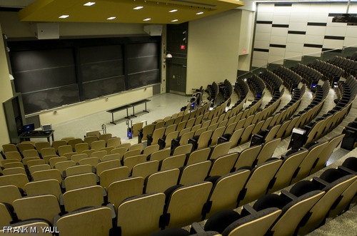 The remodeled 10-250 lecture hall boasts a new color scheme of olive green and beige, blue “runway” lights lining the steps, higher ceilings, and modern walls.