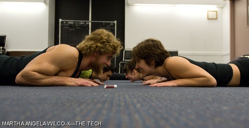 Lauren M. Biscombe ’09 and Erich Mueller ’09 participate in the Valentine Partner Yoga event sponsored by the Student Health Advisory Committee (SHAC) on Wednesday.