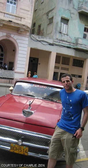 Charlie Zien ’10 poses in front of one of the many jalopies that line the streets of downtown Havana on June 29.
