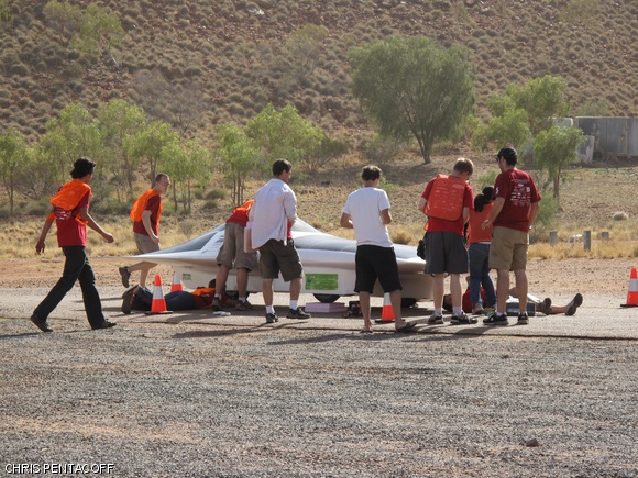 The MIT Solar Electric Vehicle team’s solar car, Eleanor, is being inspected at one of the control stops during the world solar challenge in Australia.