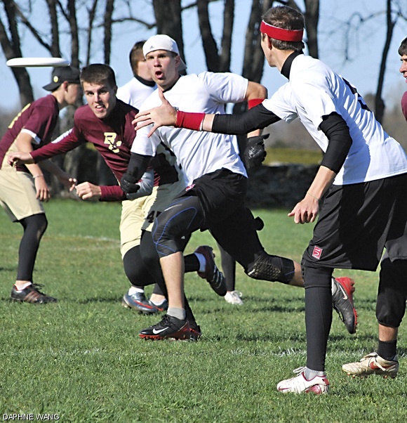 Ethan F. Gillett G throws to Brian J. Munroe G in the Metro Boston sectionals. With the win, the men’s ultimate frisbee team secured a bid to the New England regional tournament in May.