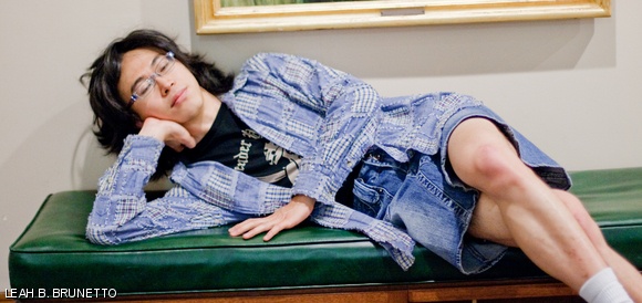 Without his wig, Yu-Pu also plays the role of Beyonce in his YouTube video. Here he poses on the bench flanking the portrait of Katherine McCormick in McCormick Hall.