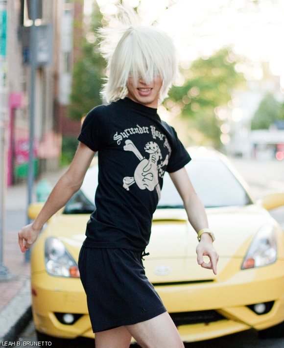 MIT chemistry graduate student Yu-Pu Wang dances in front of a bright yellow sports car parked alongside a street in Cambridge to recreate the “Shagging Wagon” dance scene appearing in Lady Gaga’s music video for “Telephone.”