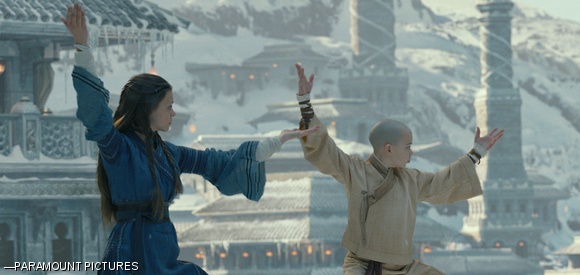 Aang (Noah Ringer) and Katara (Nicole Peltz) master their waterbending skills.