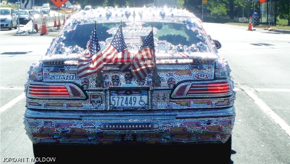 An unusually-decorated car is seen on a New York state highway.