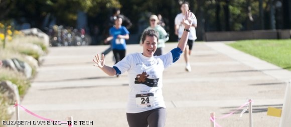 Jennifer DiMase ’01 bounds past the finish line during MIT Habitat for Humanity’s second annual Beaver Dash 5K race on Sunday. Proceeds from the more than 100 runners who participated will go towards sponsoring an MIT Habitat home in Boston.