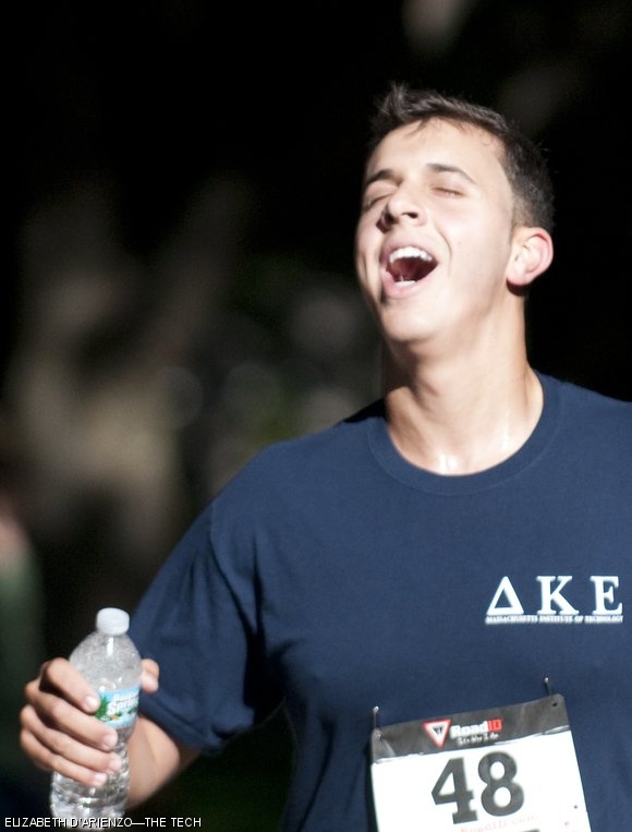 Edan Krolewicz ’12 enjoys a refreshing sip of water more than a mile into the race.