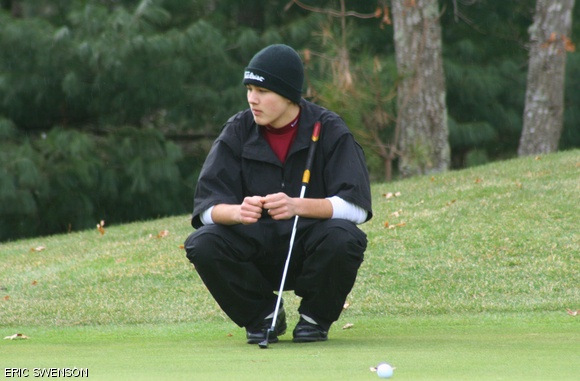 Nicholas C. Swenson ’12 reads the green during a 2009 match. Today, the golf team continues as a club sport after losing its varsity status almost two years ago.