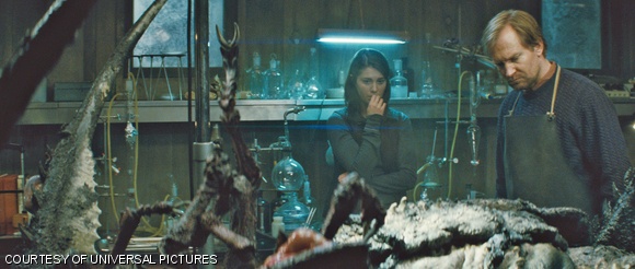 Kate (Mary Elizabeth Winstead) and Sander (Ulrich Thomsen) examine a mysterious something in “The Thing.”