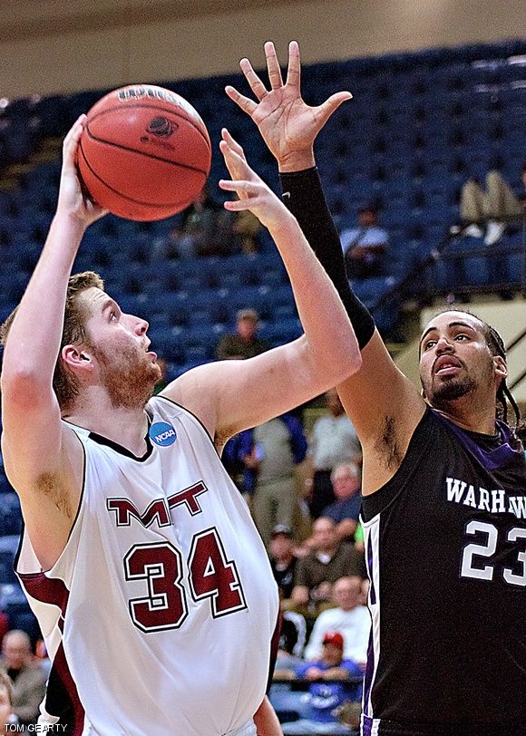 Noel Hollingsworth ’12 defends his possession of the ball against a Warhawk during the Final Four game.