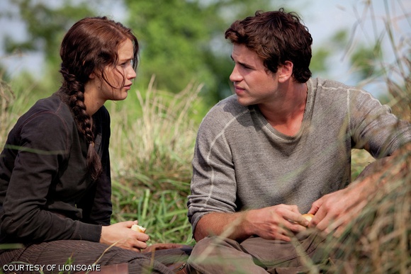 A tender moment between Katniss Everdeen (Jennifer Lawrence) and Gale Hawthorne (Liam Hemsworth).