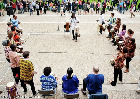 Lamine Touré leads Rambax’s performance on the Student Center steps Saturday. The Senegalese percussion group performed traditional rhythms such as “Kaolack” using mainly Sabar drums. Several audience members danced throughout the concert.