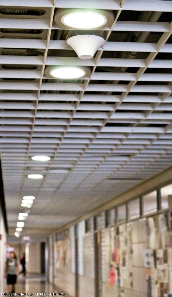 A “white cone” antenna, top center, will support enhanced cell phone reception inside MIT buildings.