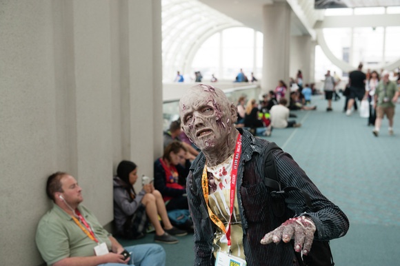A zombie cosplayer roams the halls of the San Diego Convention Center.