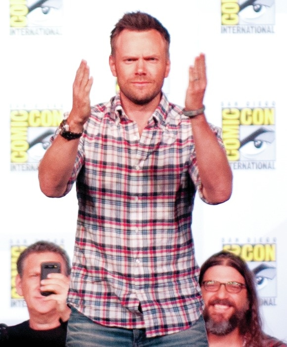 Joel McHale addresses the audience at the Community panel