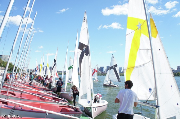 Students on the MIT Sailing Team prepare to take boats out on the Charles River on Sunday morning at the Walter C. Wood Sailing Pavilion.