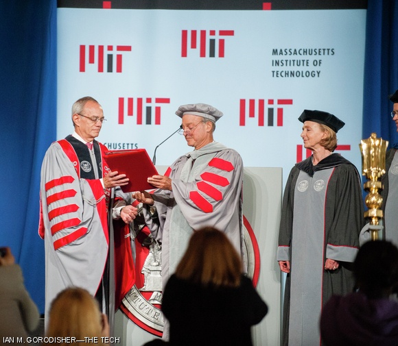 John S. Reed ’61, chairman of the MIT Corporation, hands over the Charter of MIT to President L. Rafael Reif, making Reif’s presidency official.