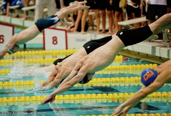 Swimmers compete in the 200-yard freestyle relay. MIT won the event with team members William C. Dunn ’14 (center), Austin D. Fathman ’15, Brendan T. Deveney ’13, and Wyatt L. Ubellacker ’13.