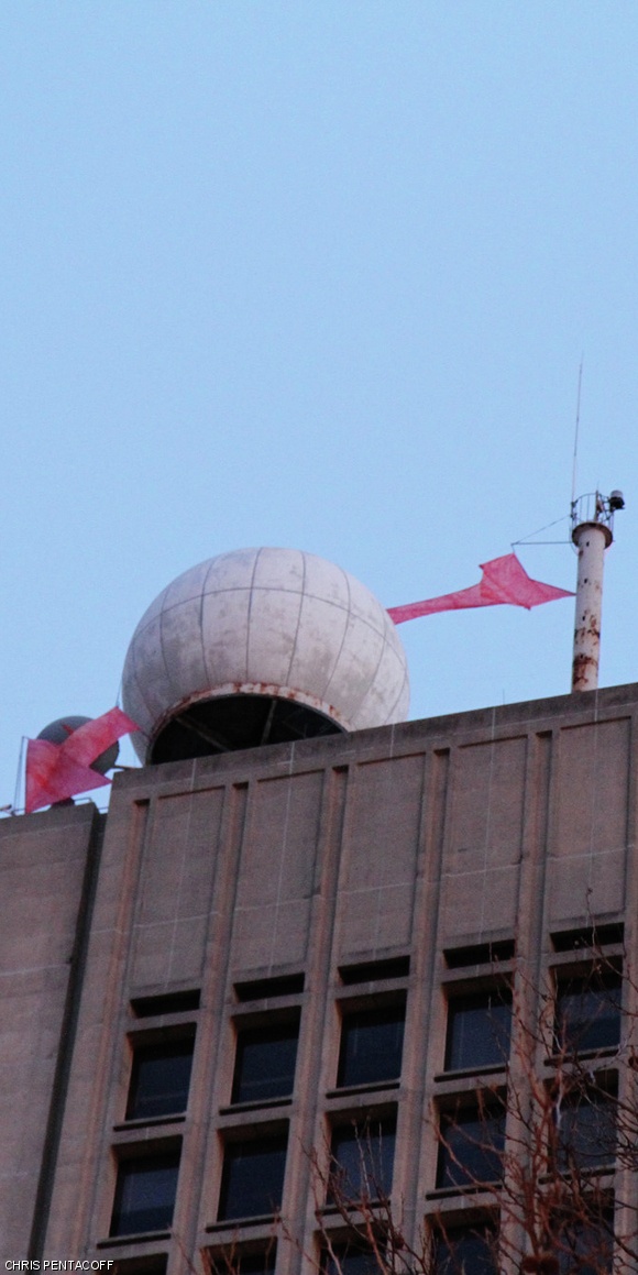A red arrow, appearing as if shot through the spherical radome atop the Green Building, appeared on Valentine’s Day.