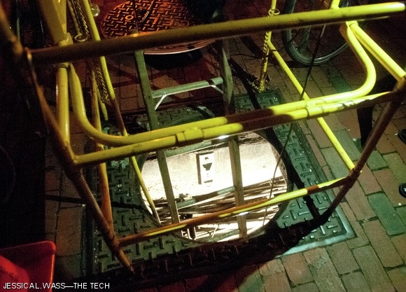 NStar workers opened a manhole and began work in Central Square.