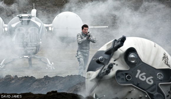 Jack (Tom Cruise) cautiously approaches a drone in Oblivion.