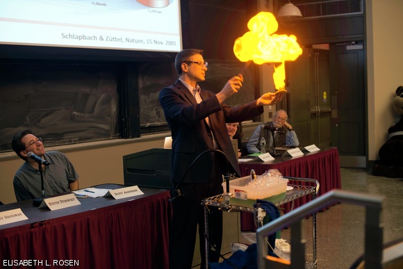 Professor Jeffrey C. Grossman demonstrates that Latkes are a better fuel than Hamentaschens by lighting one on fire at the annual Latke Hamentaschen Debate held in 10-250 on Feb. 6.