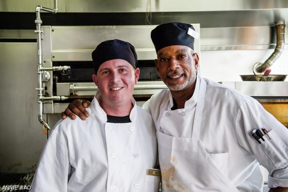 Members of the MIT Dining staff take a short break during dinner.