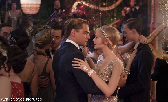 Leonardo DiCaprio as Jay Gatsby dances with Carey Mulligan as Daisy Buchanan.