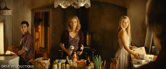 (Left to right) John D’Leo, Michelle Pfeiffer and Dianna Agron in The Family.