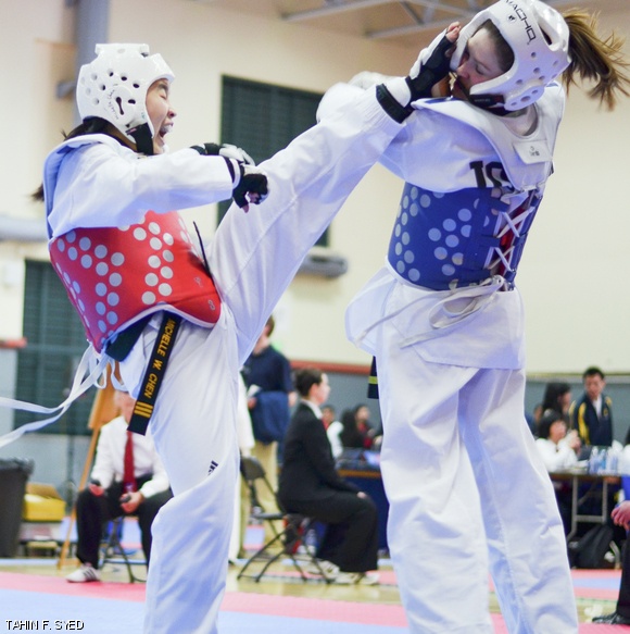 Michelle W. Chen ’14 competes in a taekwondo match against University of Iowa at the National Collegiate Taekwondo Association (NCTA) Championships on April 5.
