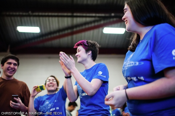 Team members celebrate the successful completion of five consecutive laps during the Unified Engineering Flight Competition.