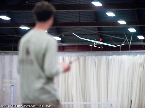 Michael R. Klinker ’14, a volunteer pilot for those who did not want to pilot their own aircraft, takes a team’s plane for one of its many laps around the circuit.