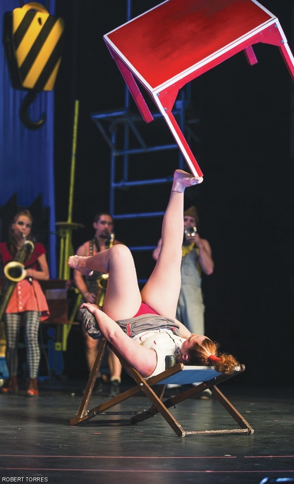 Hazel Bock of Circus Oz juggles a table with her feet at Boston’s Citi Shubert Theatre.