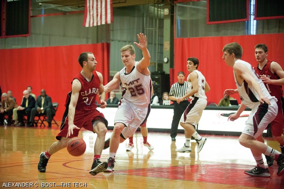 Dennis R. Levene ’15 defends a Clark University player during MIT’s convincing 80-57 win on Saturday afternoon.