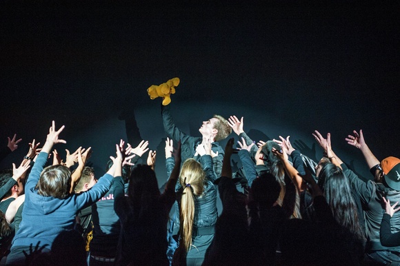 Taylor J. Herr ’18 holds up Simba in “S&amp;M Presents: The Lion King!”