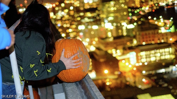 Members of East Campus’s First West hall organized their annual pumpkin drop the night of Halloween. Over 120 pumpkins were packed with flour before being released from the roof of Building 54.