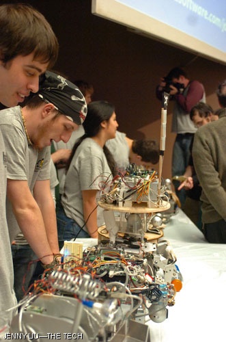 Alex St. Claire ‘08, Matt Robertson ‘08, and Yaim Cooper ‘07 showcase their robots to spectators.