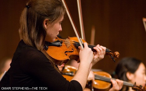Amy L. Norovich plays pizzicato during MITSO's performance of "In the Hall of the Mountain King," part of Edvard Grieg's "Peer Gynt Suite No. 1, Opus 46."