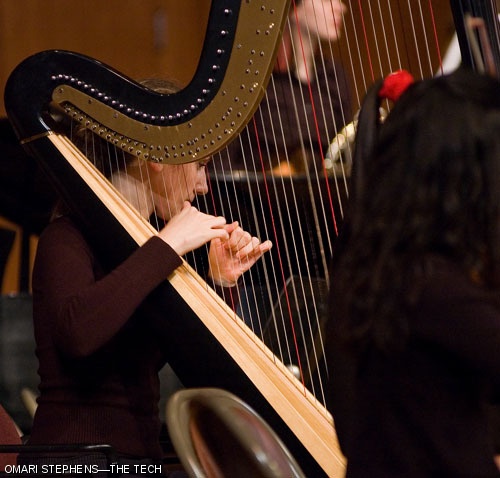 Ina Zdorovetchi, a harpist from the New England Conservatory, plays during MITSO's final piece of the night, the 1919 version of Igor Stravinsky's "The Firebird Suite."