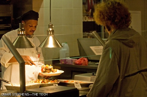 Derrick Young piles vegetables onto a plate for Richard E. Hughes '08 slightly before Pritchett Grill's closing time of 9:00 p.m. yesterday evening. Pritchett plans to offer all-you-can-eat meals throughout the remainder of spring term.