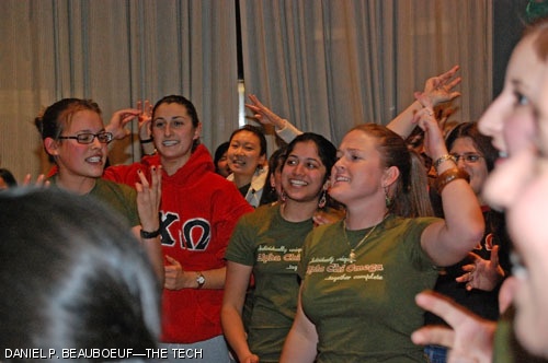 Alpha Chi Omega sisters (left to right) Gwendolyn B. Johnson ’08, Stephanie V. Brenman ’09, Meghana A. Limaye ’08, and Jessica Hickey ’07 chant at the Panhel Reaffiliation Ceremony in La Sala de Puerto Rico last Monday night.