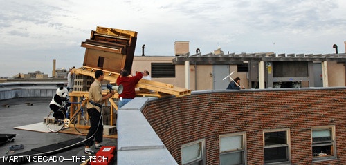 Workers prepare for Baker House’s annual Piano Drop.