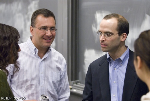 New York Times columnist David Leonhardt (right) and MIT Economics Professor Jonathan H. Gruber '87 speak with a group of students following Leonhardt's talk on Wednesday, May 2. Leonhardt spoke to a group of students and professors regarding the role of economics in the public sphere.